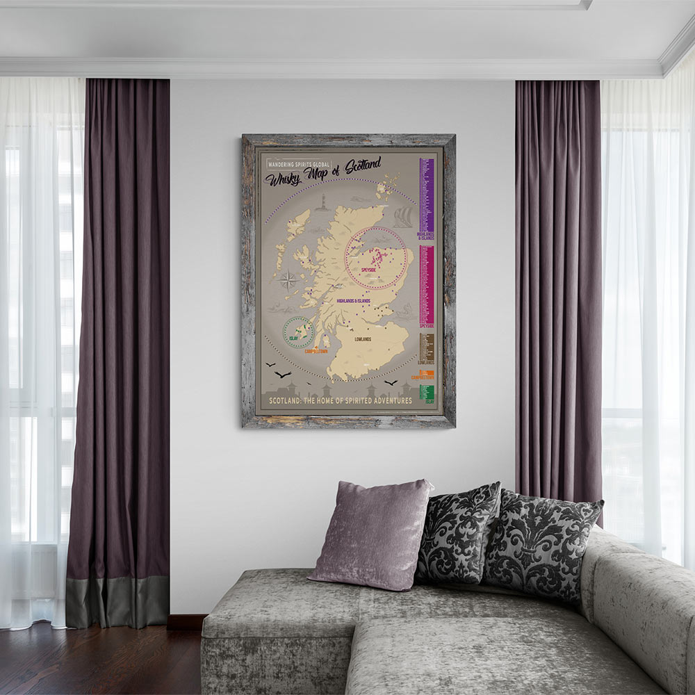 wall mounted and timber framed scotland distillery map with purple toned curtains on either side and grey couch in foreground